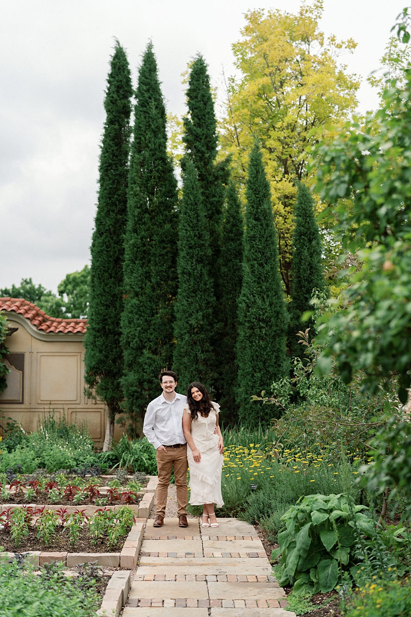 Elise and Hayden walking through the cypress garden during their Missouri Botanical Garden engagement session