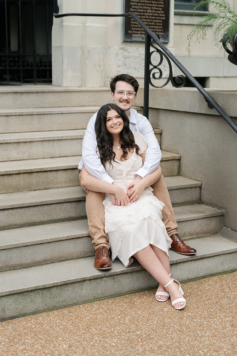 Elise and Hayden seated together on garden steps