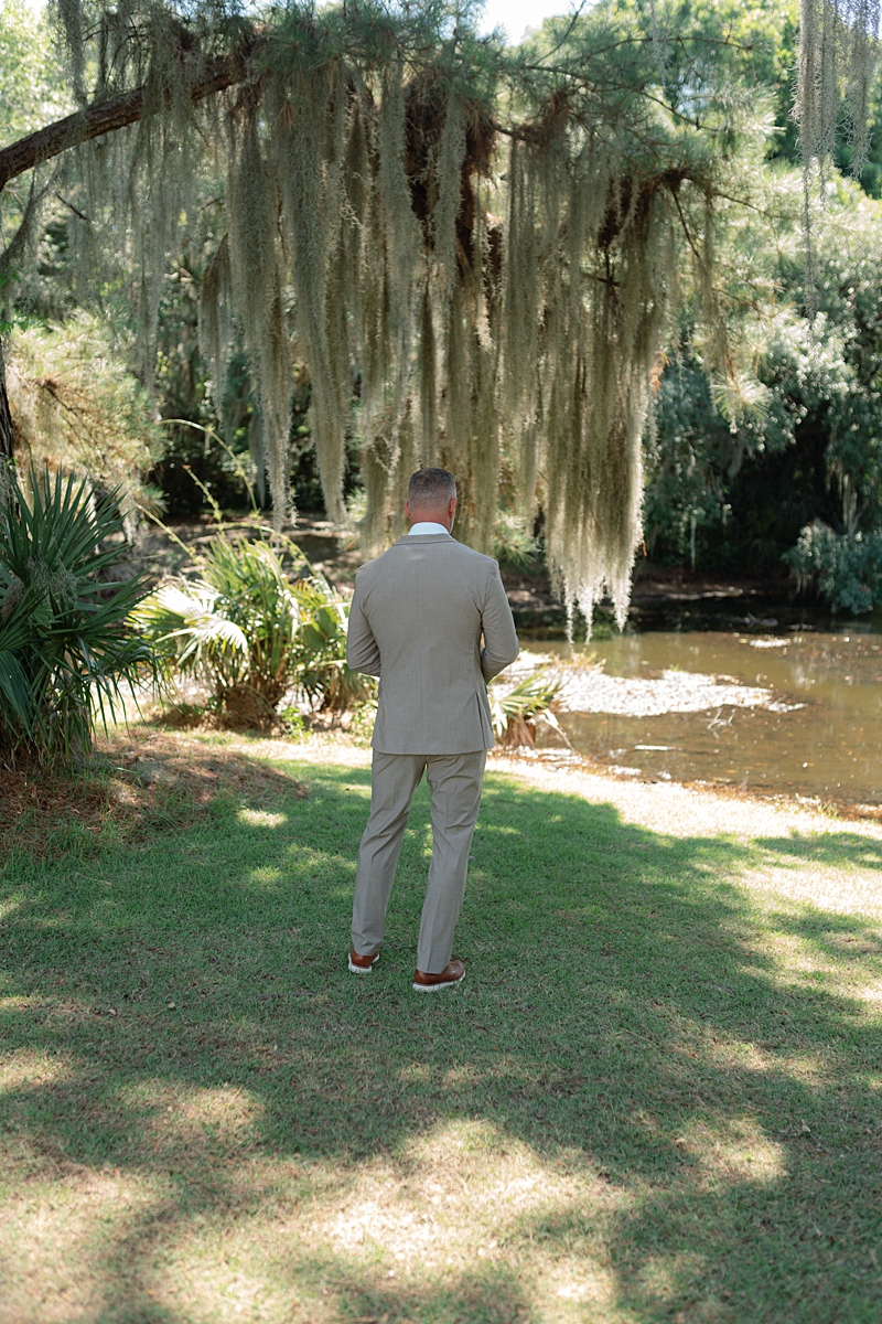Clayton waiting beside the lagoon for his first look with Haile
