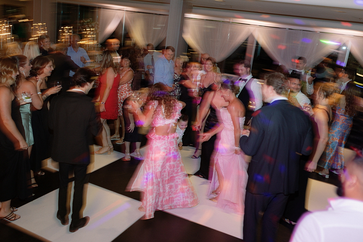 Guests photographed candidly during a St. Louis wedding reception