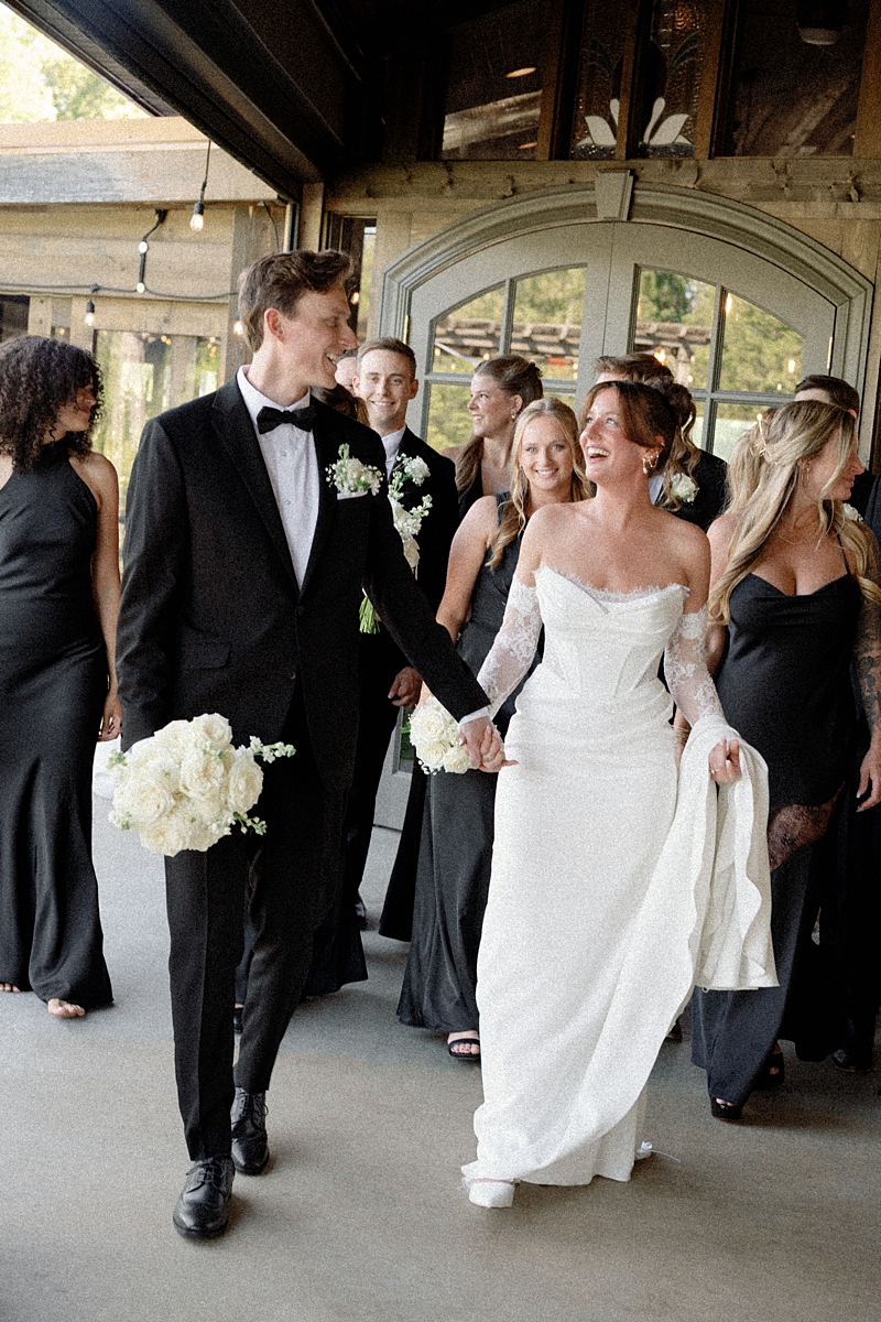 Luke and Katie walking with friends after the ceremony