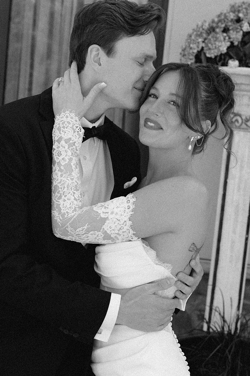 Luke and Katie dancing together outside during their wedding portraits