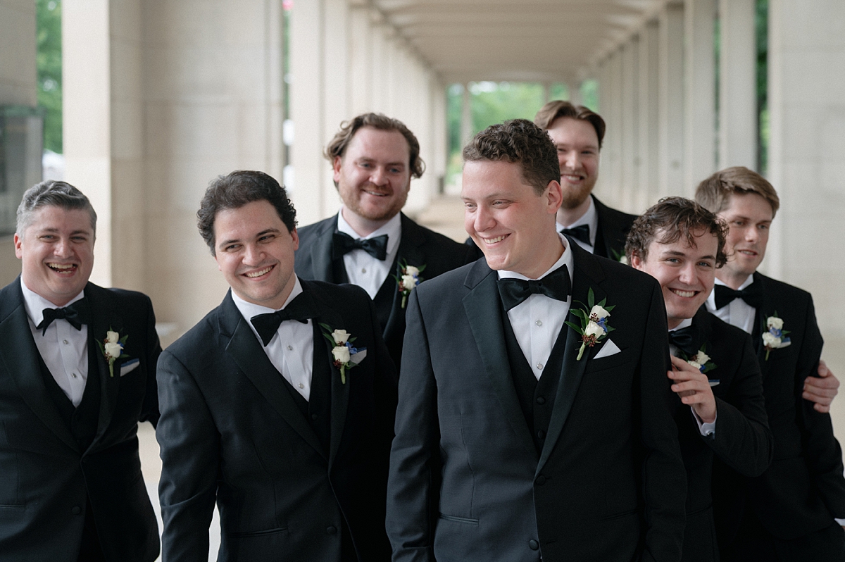 Dylan with his groomsmen during wedding party portraits in Forest Park