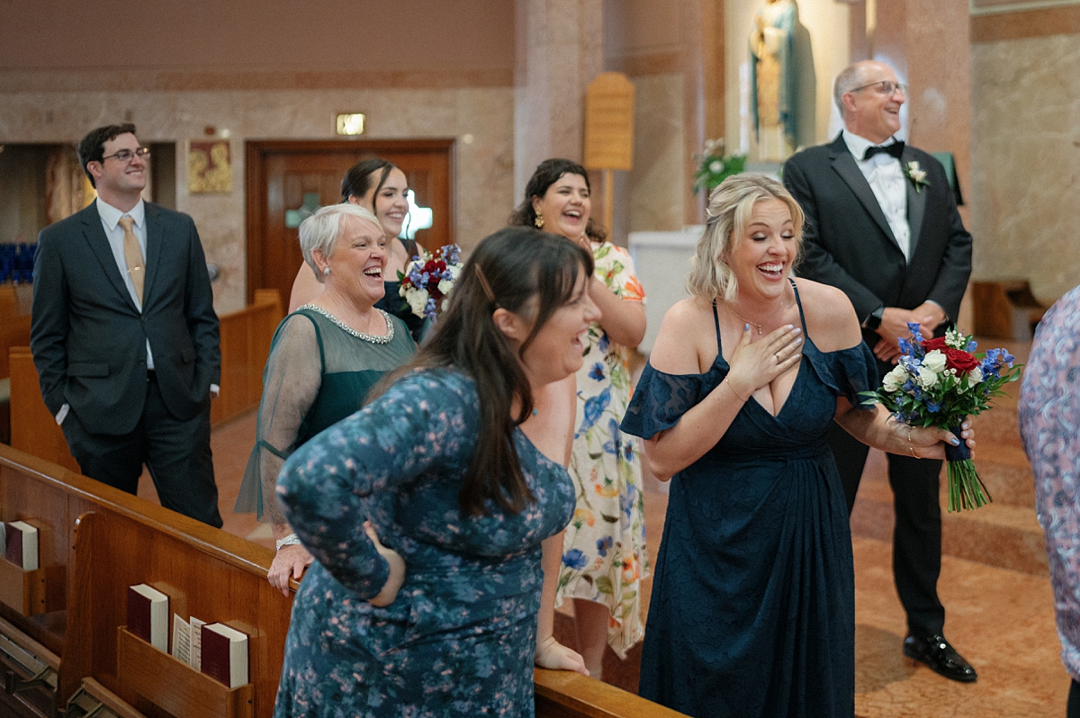 Guests reacting together inside St. Gabriel Catholic Church