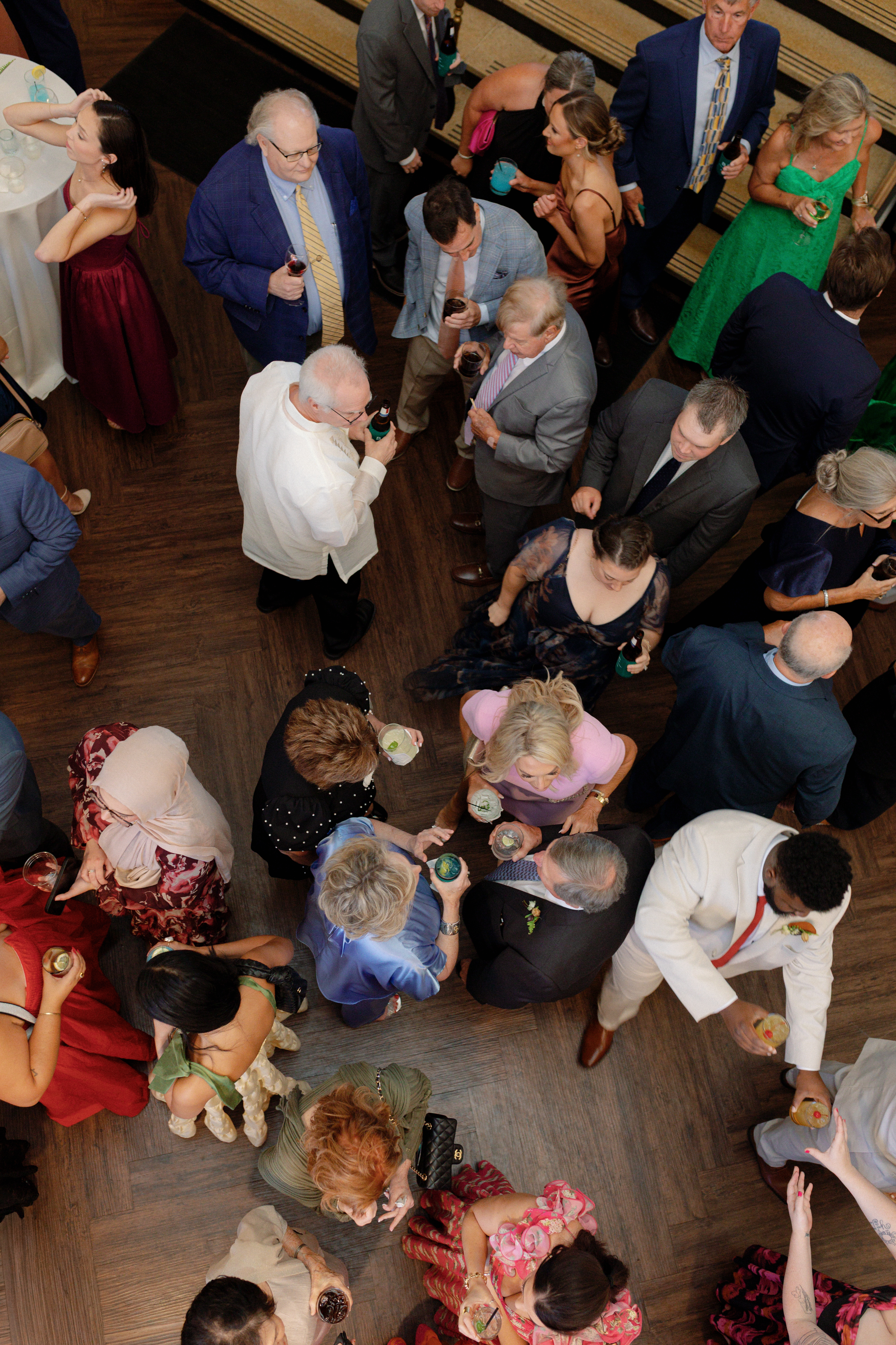 Wedding guests talking together during cocktail hour