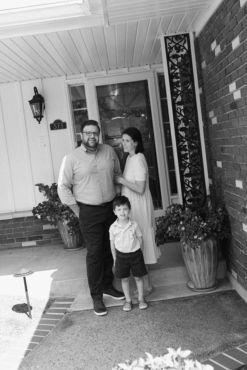 Parents and their son photographed together on the front porch in St. Louis