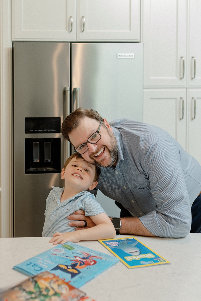 Father hugging his son during an at-home family session in St. Louis