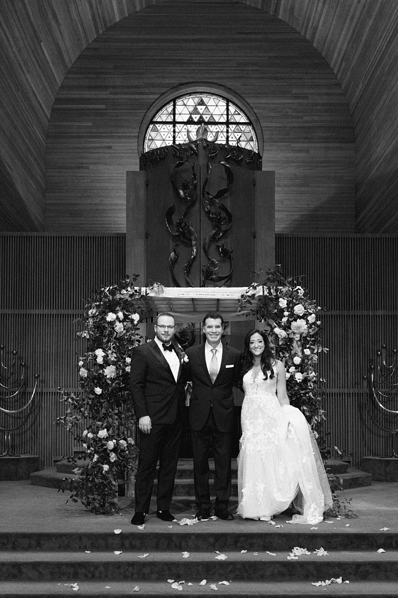 Allie and Nathan with family in the sanctuary after their ceremony