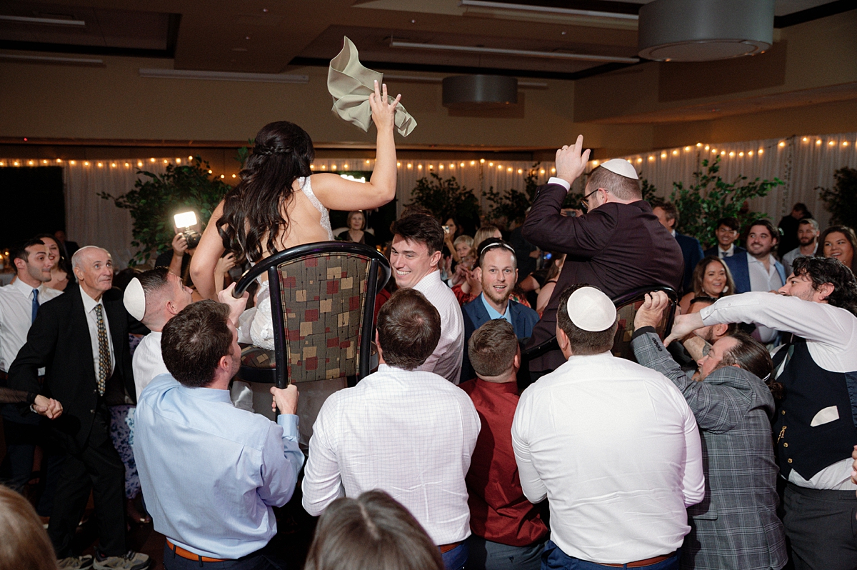 Allie and Nathan above the crowd as guests dance the hora