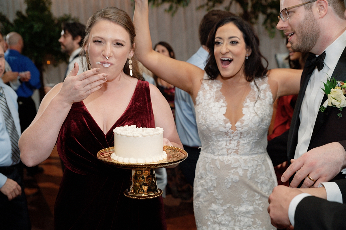 A friend reacting to a birthday cake surprise from Allie and Nathan
