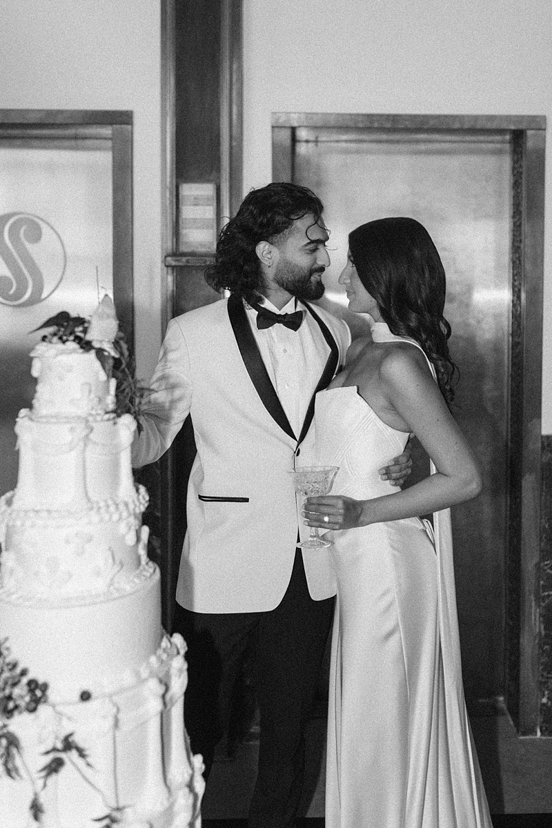 Oversized wedding cake displayed inside The Noble wedding venue