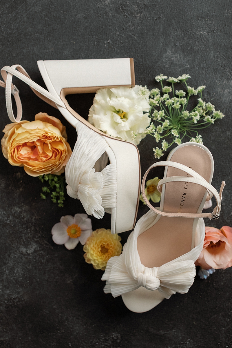 Allie's wedding shoes arranged with flowers