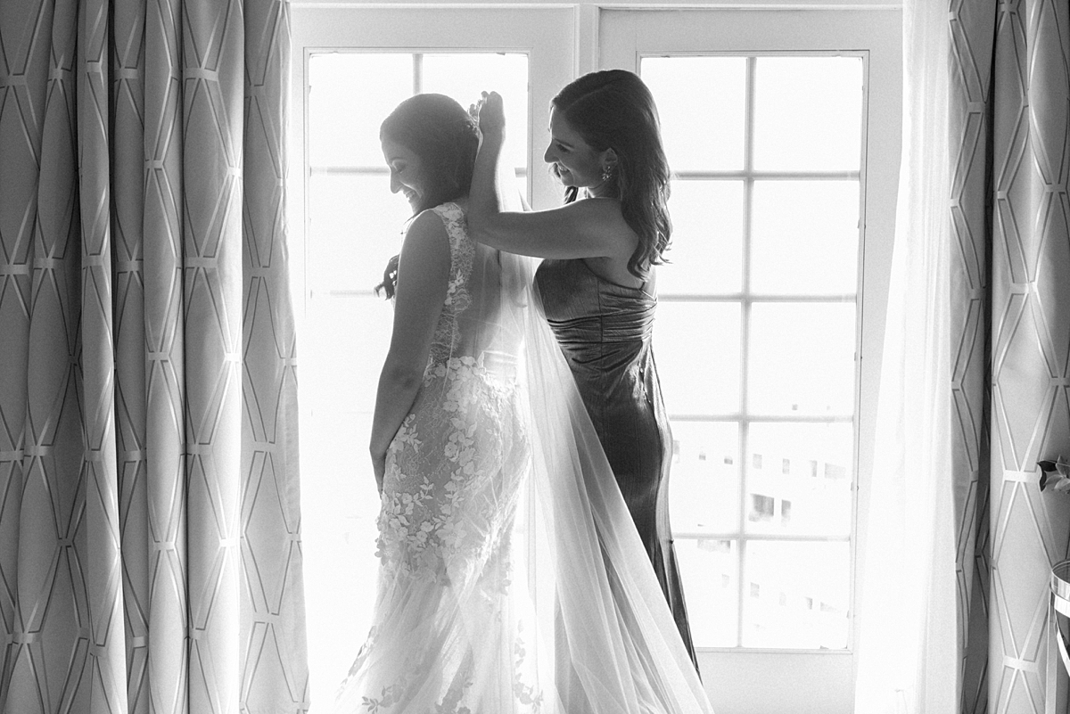 Getting ready at The Ritz-Carlton St. Louis as Allie is helped into her wedding dress