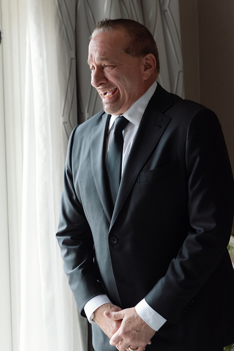 Allie's dad smiling after seeing her dressed for the wedding