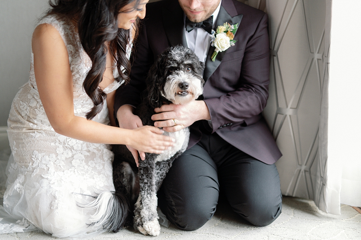 Allie and Nathan sitting together with their dog Bear