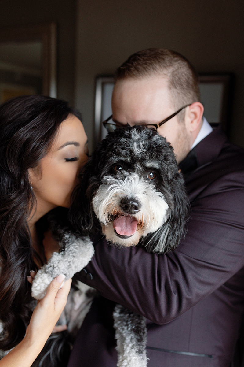 Allie and Nathan cuddling Bear at The Ritz-Carlton St. Louis