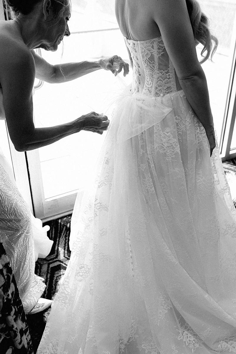 Editorial bridal portrait showing wedding dress details
