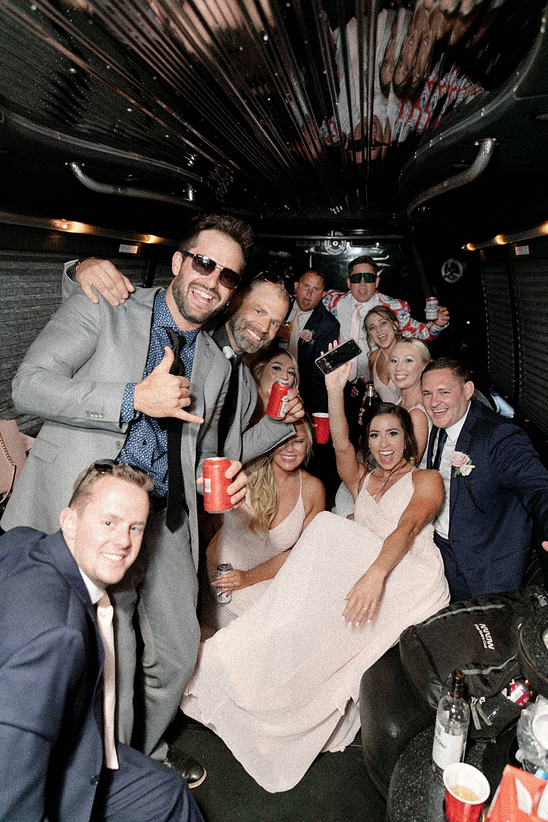 Wedding party traveling between portrait locations in St. Louis