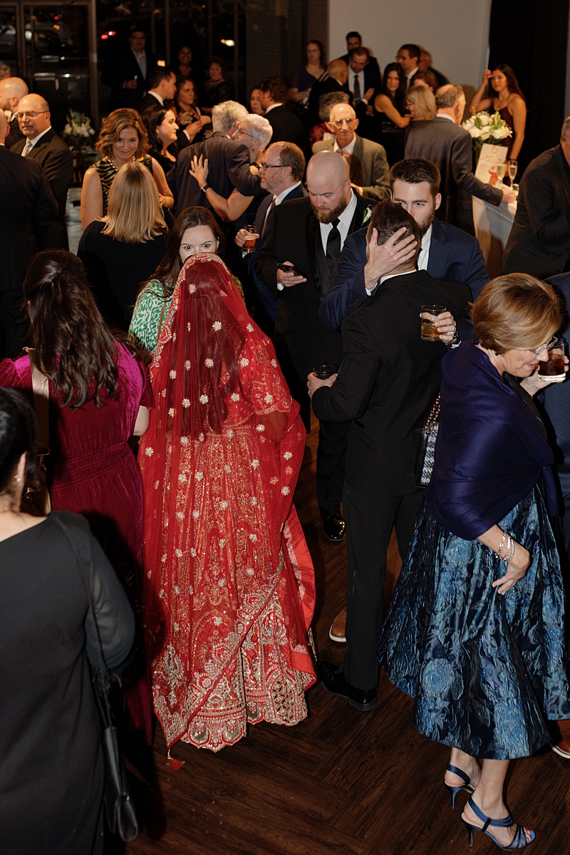 Newlyweds spending time with guests during their cocktail hour