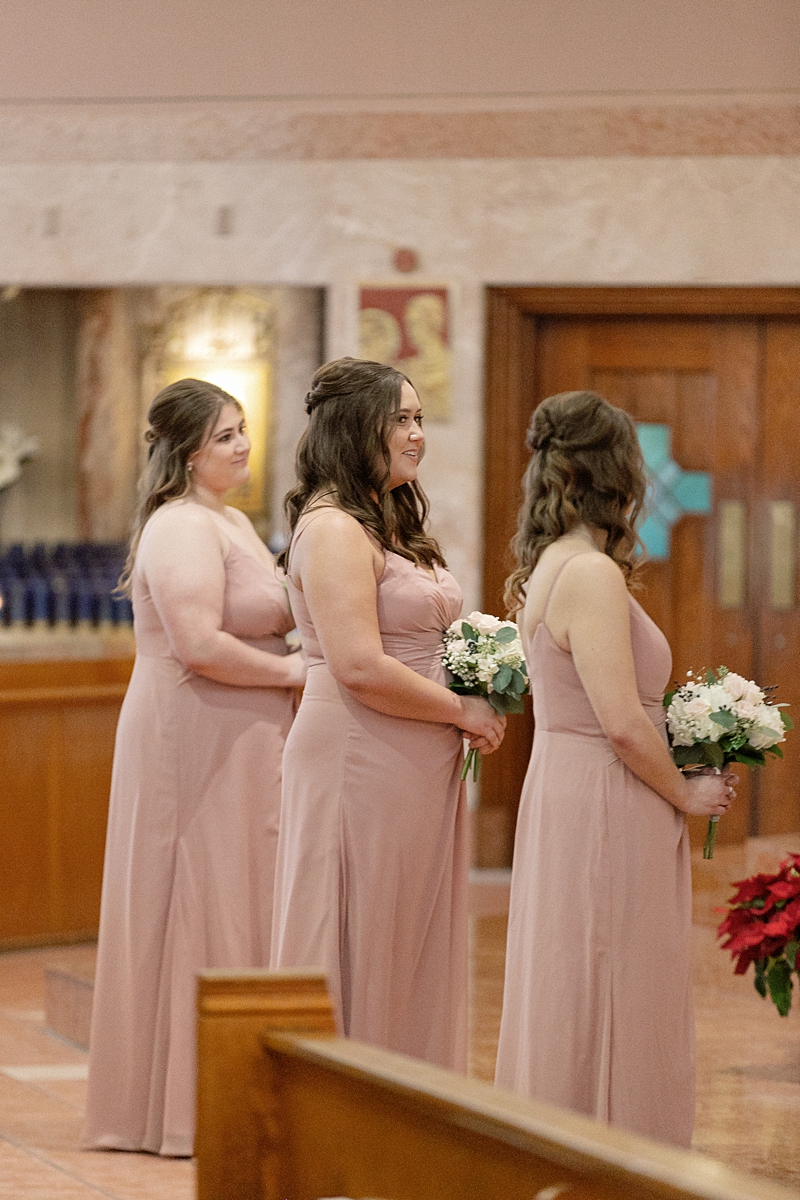 Family moment during Andrea and Jason's St. Gabriel wedding ceremony