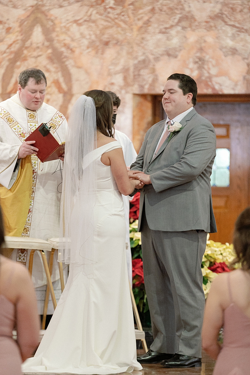 Andrea and Jason during their wedding ceremony at St. Gabriel