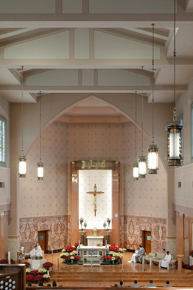 Wide interior view of St. Gabriel during Andrea and Jason's wedding ceremony