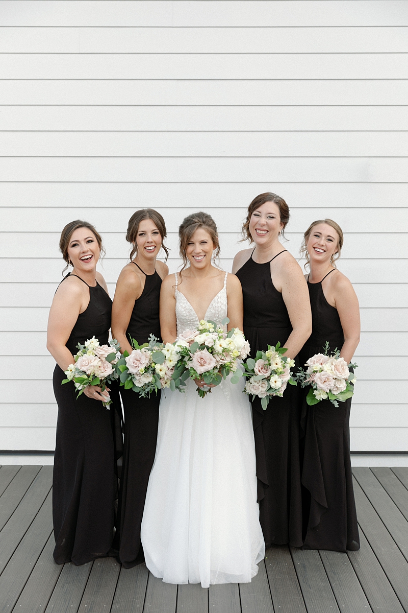 Bridesmaids photographed on the rooftop at The Bardot wedding venue in Kansas City
